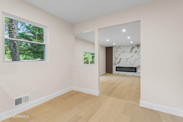 5 Rose St, Lincroft, NJ 07738 - unfurnished room with light wood finished floors, baseboards, a high end fireplace, and recessed lighting