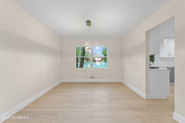 5 Rose St, Lincroft, NJ 07738 - unfurnished dining area with light wood-style flooring, a chandelier, baseboards, and a sink