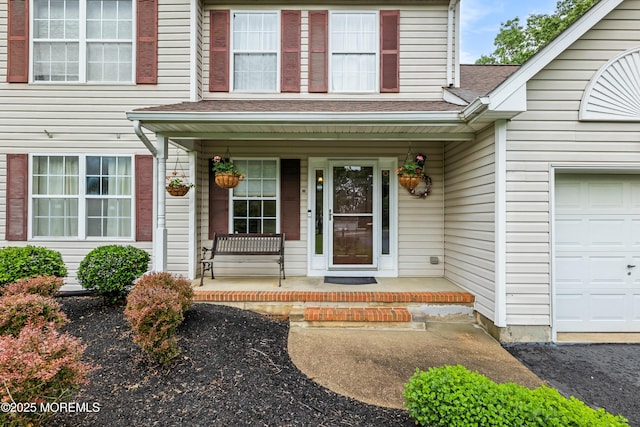 17 Durell Dr, Jackson, NJ 08527 - entrance to property featuring covered porch, an attached garage, and roof with shingles