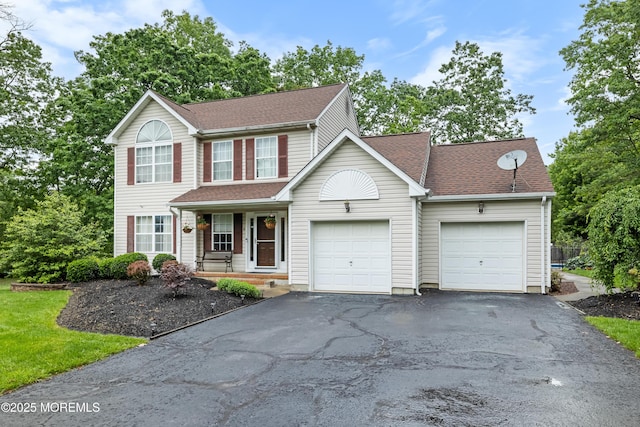 17 Durell Dr, Jackson, NJ 08527 - view of front of property with driveway, an attached garage, covered porch, and a shingled roof