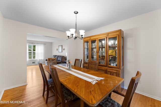 17 Durell Dr, Jackson, NJ 08527 - dining area featuring a chandelier, light wood-style floors, and baseboards