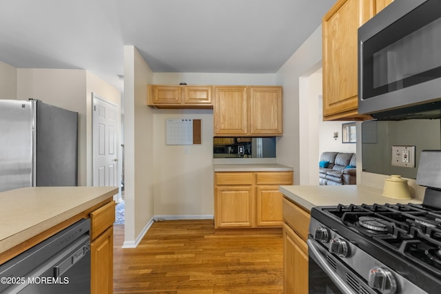 17 Durell Dr, Jackson, NJ 08527 - kitchen with appliances with stainless steel finishes, light countertops, light wood finished floors, and light brown cabinets