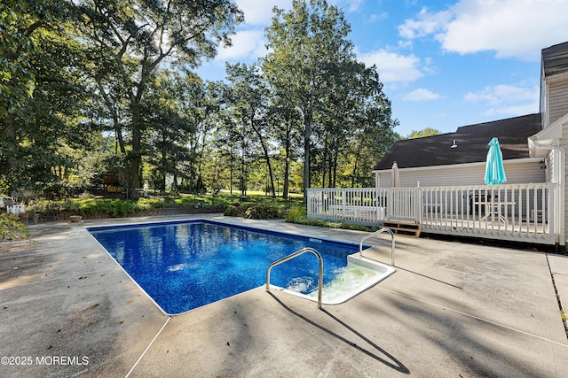 17 Durell Dr, Jackson, NJ 08527 - swimming pool with a wooden deck, a patio area, and view of wooded area