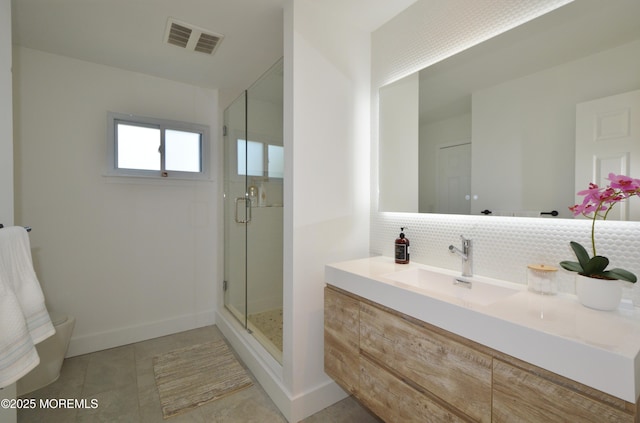 11 Fern Ct, Tinton Falls, NJ 07724 - full bathroom featuring decorative backsplash, a stall shower, vanity, tile patterned floors, and baseboards