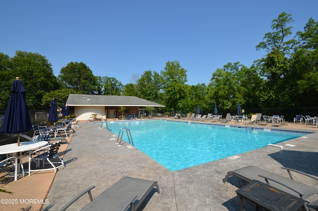 11 Fern Ct, Tinton Falls, NJ 07724 - community pool with a patio area and view of wooded area