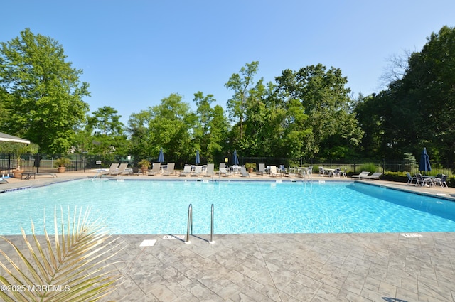 11 Fern Ct, Tinton Falls, NJ 07724 - community pool featuring a patio and view of wooded area