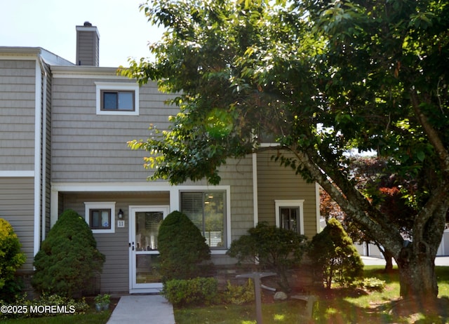 11 Fern Ct, Tinton Falls, NJ 07724 - rear view of house with a chimney