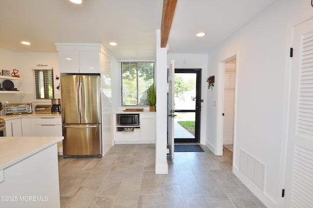 11 Fern Ct, Tinton Falls, NJ 07724 - kitchen featuring stainless steel appliances, light countertops, white cabinetry, recessed lighting, and modern cabinets