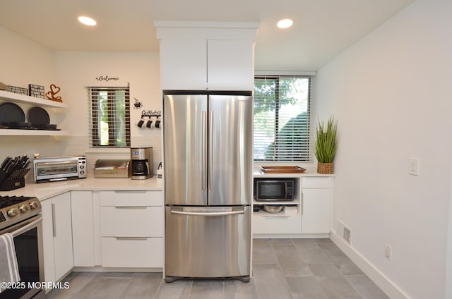 11 Fern Ct, Tinton Falls, NJ 07724 - kitchen featuring stainless steel appliances, plenty of natural light, white cabinets, light countertops, and recessed lighting