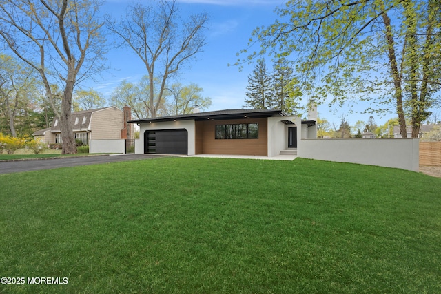 441 Slocum Pl, Oakhurst, NJ 07755 - view of front of house with asphalt driveway, an attached garage, and a chimney