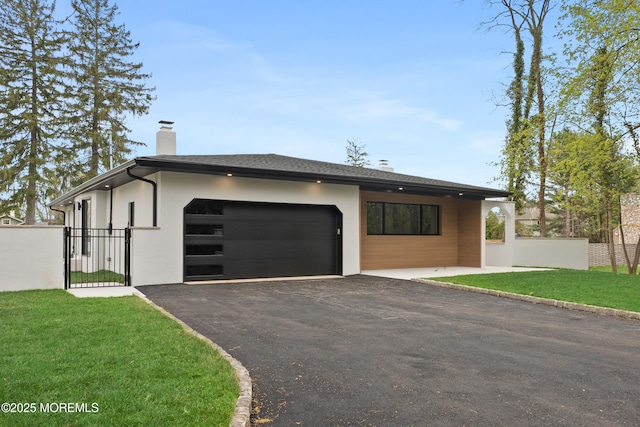 441 Slocum Pl, Oakhurst, NJ 07755 - contemporary house with an attached garage, a chimney, driveway, a gate, and stucco siding