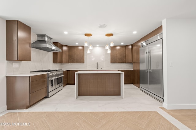 441 Slocum Pl, Oakhurst, NJ 07755 - kitchen with premium appliances, island exhaust hood, decorative backsplash, light countertops, and pendant lighting