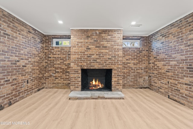 441 Slocum Pl, Oakhurst, NJ 07755 - unfurnished living room featuring brick wall, wood finished floors, and a fireplace