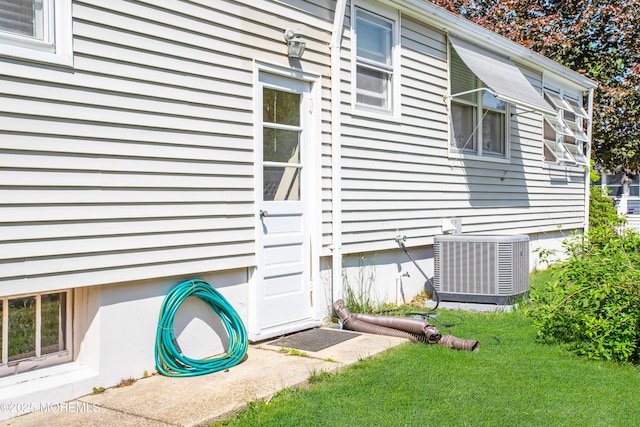 81 Curtis Pl, Manasquan, NJ 08736 - view of home's exterior featuring central AC unit and a yard