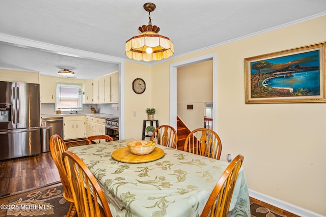 81 Curtis Pl, Manasquan, NJ 08736 - dining space with dark wood-type flooring, ornamental molding, and baseboards