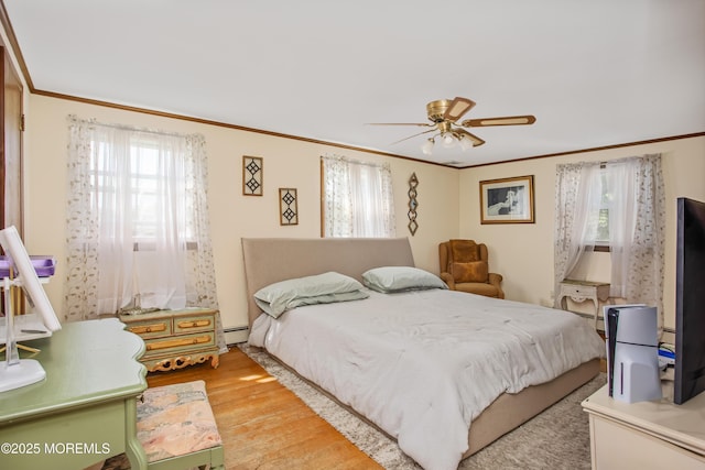 81 Curtis Pl, Manasquan, NJ 08736 - bedroom featuring light wood-type flooring, ornamental molding, ceiling fan, and a baseboard heating unit