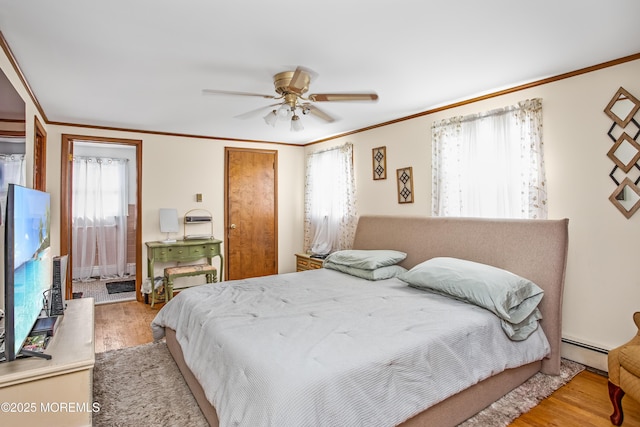 81 Curtis Pl, Manasquan, NJ 08736 - bedroom with a baseboard heating unit, ornamental molding, wood finished floors, ceiling fan, and a closet