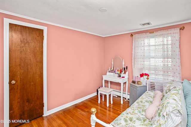 81 Curtis Pl, Manasquan, NJ 08736 - bedroom with wood finished floors, crown molding, a baseboard heating unit, and baseboards