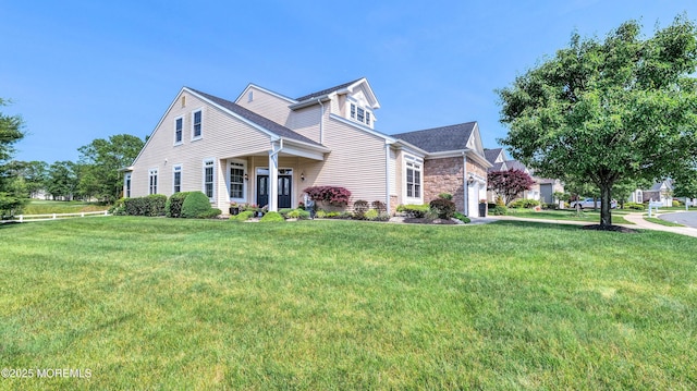 38 Ocean Grove Ln, Waretown, NJ 08758 - traditional-style house featuring a garage, a front lawn, and stone siding