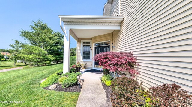 38 Ocean Grove Ln, Waretown, NJ 08758 - doorway to property with a lawn