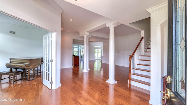 38 Ocean Grove Ln, Waretown, NJ 08758 - entrance foyer featuring ornate columns, crown molding, light wood-style floors, stairs, and recessed lighting
