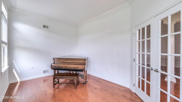 38 Ocean Grove Ln, Waretown, NJ 08758 - living area with french doors, ornamental molding, wood finished floors, and baseboards