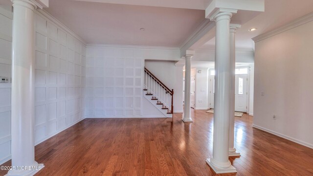 38 Ocean Grove Ln, Waretown, NJ 08758 - unfurnished room with ornamental molding, stairs, wood finished floors, baseboards, and ornate columns