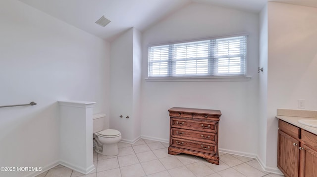 38 Ocean Grove Ln, Waretown, NJ 08758 - bathroom featuring vanity, toilet, lofted ceiling, tile patterned floors, and baseboards