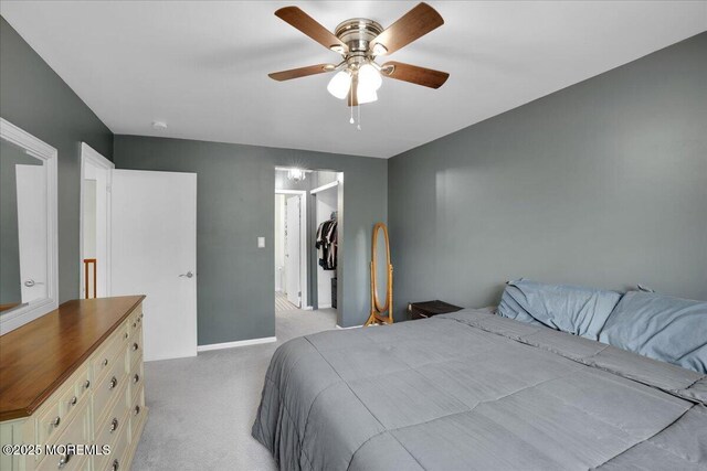 503 Oswego Ct, Mount Laurel, NJ 08054 - bedroom featuring light colored carpet, a spacious closet, a closet, and ceiling fan