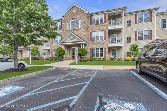 113 Sophee Ln, Lakewood, NJ 08701 - view of front of home with uncovered parking and a front yard