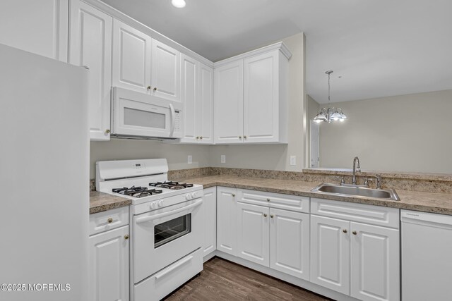 113 Sophee Ln, Lakewood, NJ 08701 - kitchen with white appliances, a sink, white cabinetry, dark wood-type flooring, and light countertops