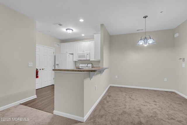 113 Sophee Ln, Lakewood, NJ 08701 - kitchen featuring white appliances, baseboards, a peninsula, carpet flooring, and recessed lighting