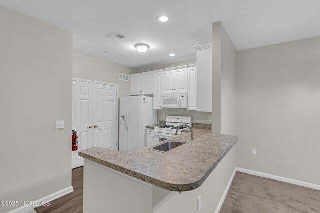 113 Sophee Ln, Lakewood, NJ 08701 - kitchen featuring white appliances, baseboards, a sink, white cabinetry, and recessed lighting