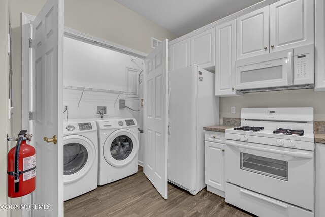 113 Sophee Ln, Lakewood, NJ 08701 - laundry area featuring washer and dryer and wood finished floors