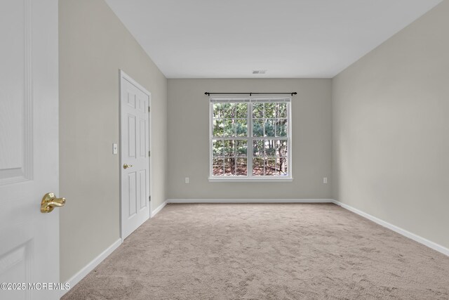 113 Sophee Ln, Lakewood, NJ 08701 - empty room with carpet floors and baseboards