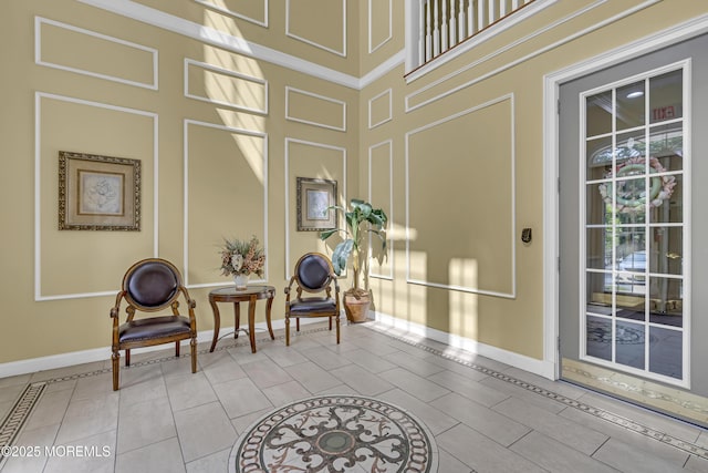 113 Sophee Ln, Lakewood, NJ 08701 - sitting room with baseboards, a decorative wall, and tile patterned flooring