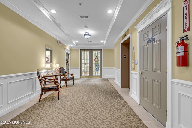 113 Sophee Ln, Lakewood, NJ 08701 - hallway with light tile patterned floors, recessed lighting, a decorative wall, a raised ceiling, and wainscoting