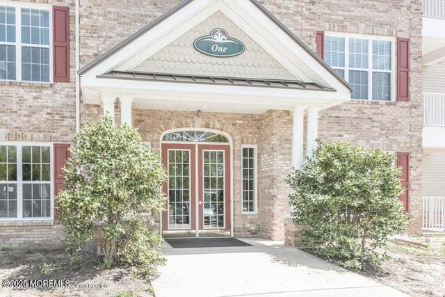 113 Sophee Ln, Lakewood, NJ 08701 - entrance to property with brick siding and french doors