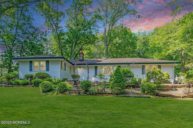 7 E Parkway Pl, Holmdel, NJ 07733 - view of front of house with a chimney and a yard