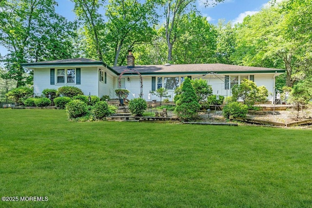 7 E Parkway Pl, Holmdel, NJ 07733 - view of front facade featuring a chimney and a front lawn