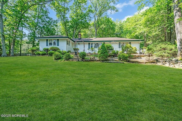 7 E Parkway Pl, Holmdel, NJ 07733 - ranch-style house featuring a front yard and a chimney