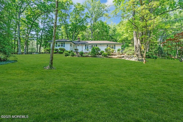 7 E Parkway Pl, Holmdel, NJ 07733 - view of front of property featuring a front lawn and a chimney