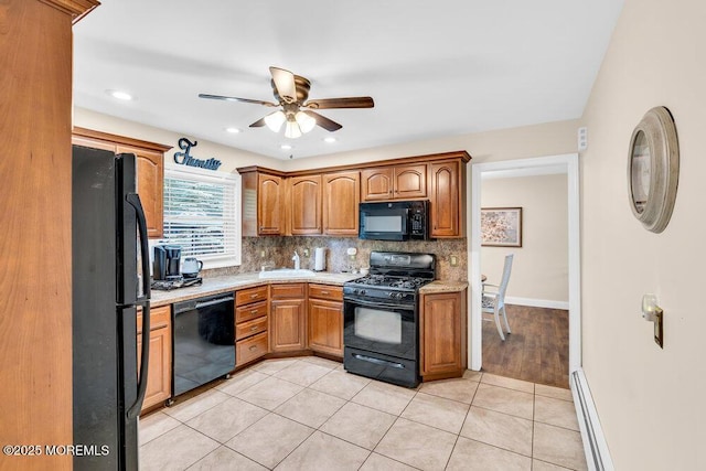 7 E Parkway Pl, Holmdel, NJ 07733 - kitchen featuring black appliances, light countertops, a sink, a ceiling fan, and backsplash