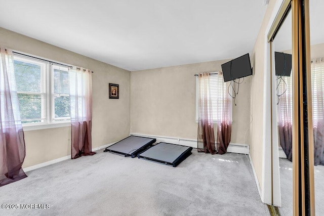7 E Parkway Pl, Holmdel, NJ 07733 - spare room featuring light carpet, baseboards, and baseboard heating