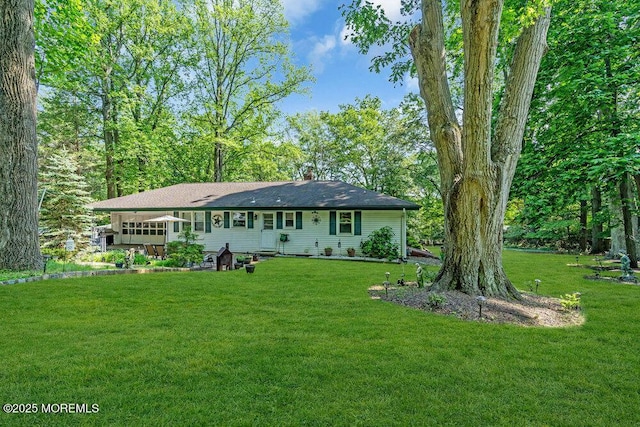7 E Parkway Pl, Holmdel, NJ 07733 - rear view of house featuring a yard and a chimney