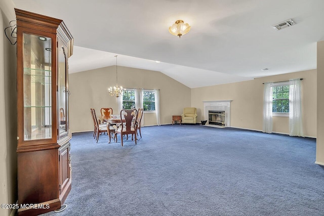 153 Lloyd Rd, Matawan, NJ 07747 - dining room with a chandelier, carpet floors, lofted ceiling, plenty of natural light, and a glass covered fireplace