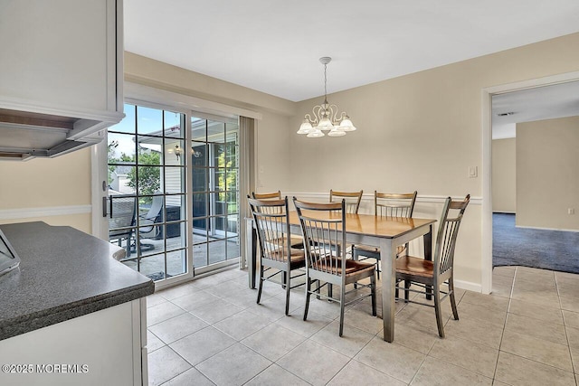 153 Lloyd Rd, Matawan, NJ 07747 - dining area with light tile patterned floors and a chandelier