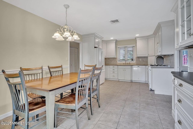 153 Lloyd Rd, Matawan, NJ 07747 - dining room with a chandelier, light tile patterned flooring, and recessed lighting