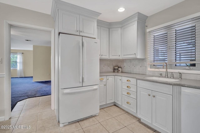 153 Lloyd Rd, Matawan, NJ 07747 - kitchen with white appliances, light tile patterned floors, white cabinetry, light carpet, and recessed lighting