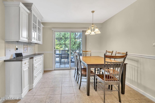 153 Lloyd Rd, Matawan, NJ 07747 - dining room with a chandelier and light tile patterned floors